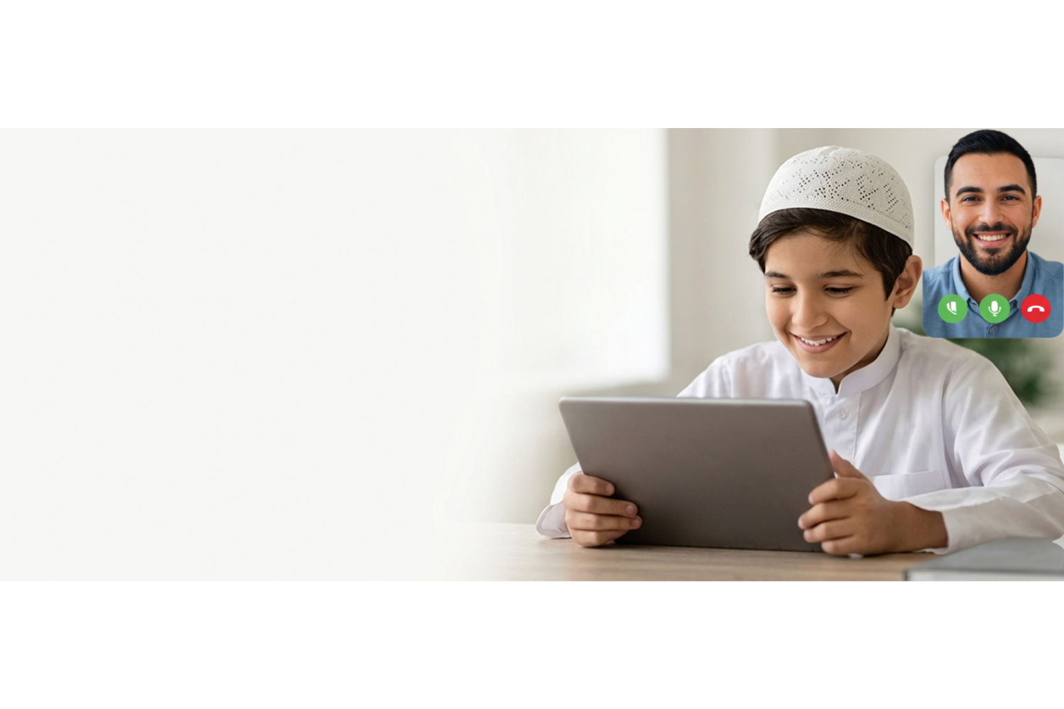 A young student smiling during his live Quran class on a tablet with his tutor